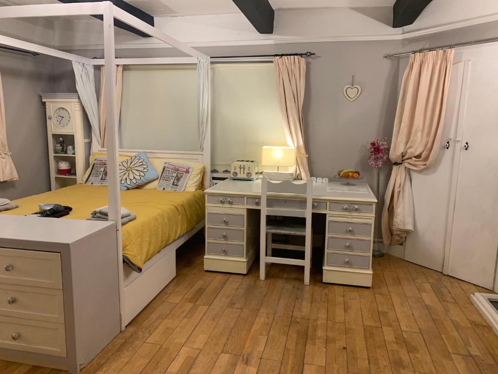 Four-poster bedroom at Halzephron House